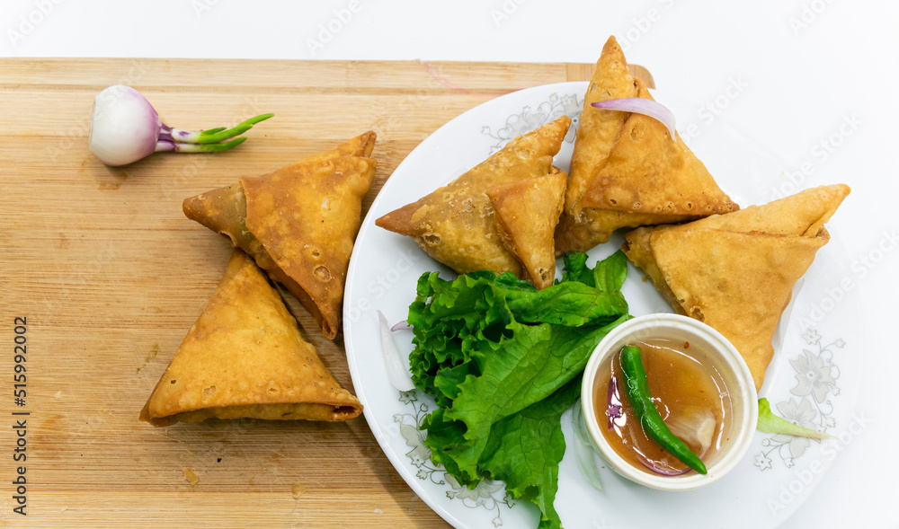 Samosa isolated on white background, vegetable snacks. Samosa isolated on white background, vegetable snacks.