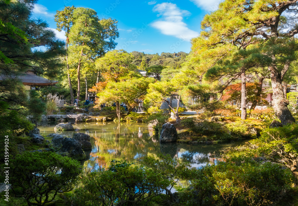 Beautiful golden light and autumn colours with reflections in the pond at the Silver Pavillion or Ginkaku-Ji Zen Temple and gardens, one of the 'must see' destinations in Kyoto, Japan. Beautiful golden light and autumn colours with reflections in the pond at the Silver Pavillion or Ginkaku-Ji Zen Temple and gardens, one of the 'must see' destinations in Kyoto, Japan.