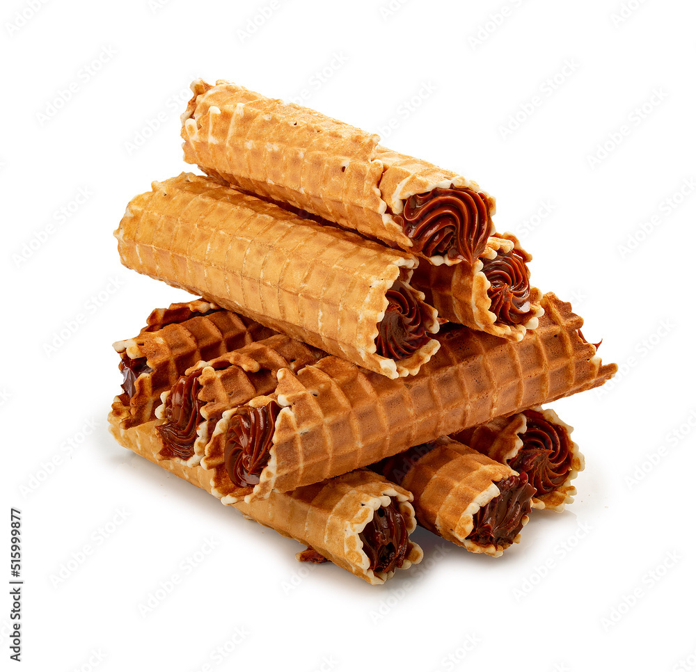Wafer tubes filled with condensed milk cream. On a white background, isolated. Wafer tubes filled with condensed milk cream. On a white background, isolated.