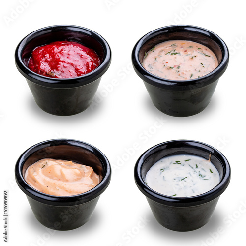 Set of four different sauces. On white background, isolated. © GrumJum