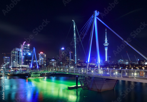 Auckland, New Zealand, at night, seen from the Viaduct Basin bridge. To the center right is the iconic Sky Tower © Michael