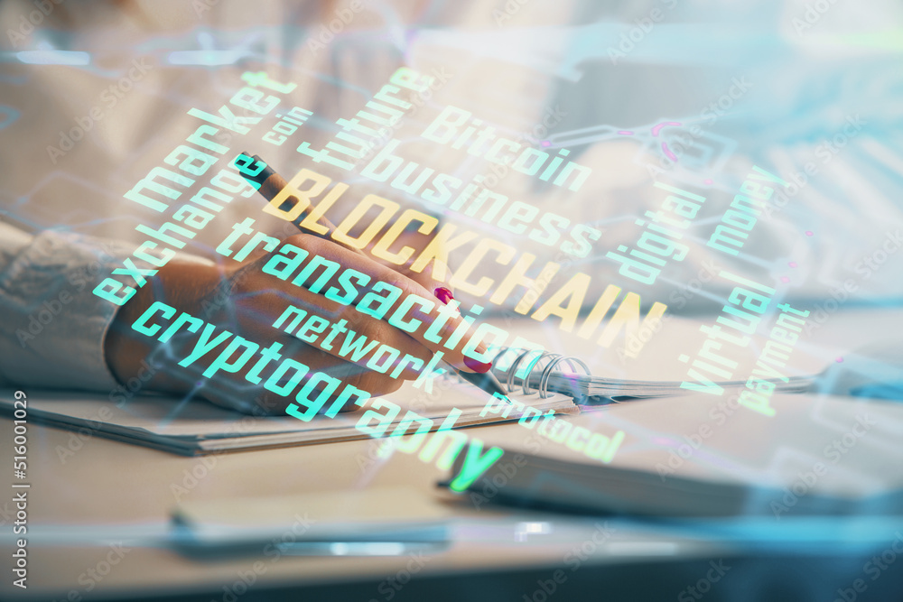 Cryptocurrency hologram over woman's hands writing background. Concept of blockchain. Double exposure Cryptocurrency hologram over woman's hands writing background. Concept of blockchain. Double exposure