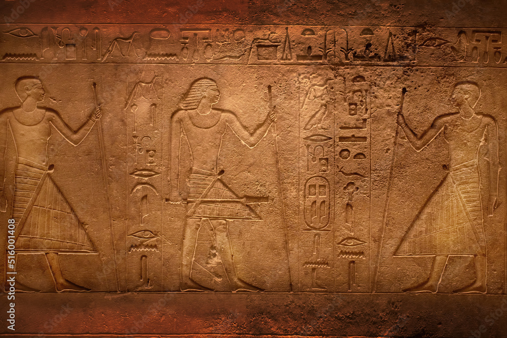 Fototapeta premium Hieroglyphic carving on an ancient Egyptian sargophagus in an ancient temple, selective focus