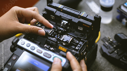 Fotografi Fiberoptic Fusion Splicing Technician , Internet cable connection, fiber optic fusion splicing machine