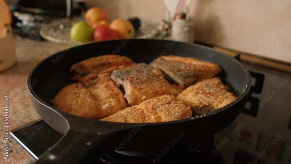 Frying fish in a pan at home on the stove. Frying fish in a pan at home on the stove.