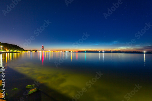 Noctilucent clouds over the Gdynia cityscape at night. Poland