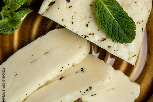 Traditional slices of cyprus halloumi cheese with mint. healthy eco food. Food recipe background. Close up photo