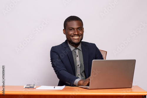 black businessman smiling while working