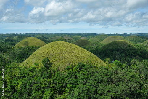 Bohol, Philippines - July 2022: The Chocolate Hills are a geological formation in Bohol Island on July 3, 2022 in Bohol, Philippines. photo