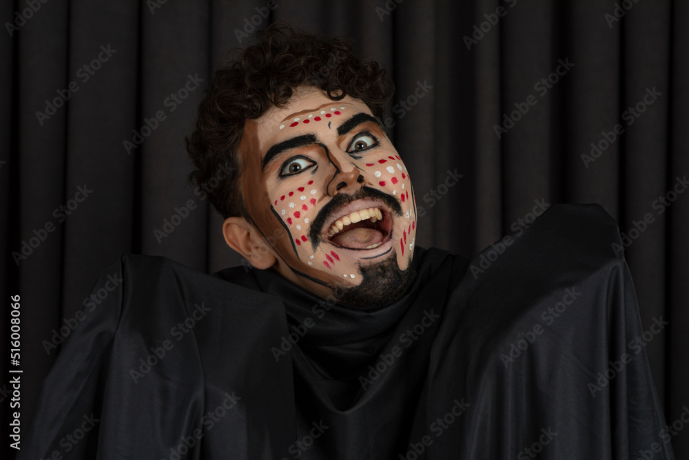 Young man with makeup smiling to the camera Young man with makeup smiling to the camera