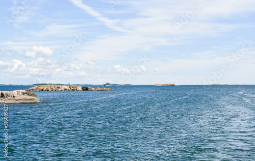 Fototapeta Naklejka Na Ścianę i Meble -  Seascape in the archipelago of Finland in July 2022 with an army vessel in the background