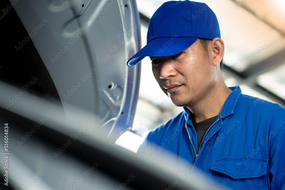 Choseup of Mechanic engineer hand holding checklist the car at service center. Choseup of Mechanic engineer hand holding checklist the car at service center.