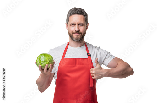 man in apron with cabbage vegetable isolated on white. thumb up