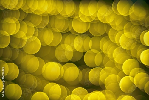 Bokeh effect golden yellow defocused light background