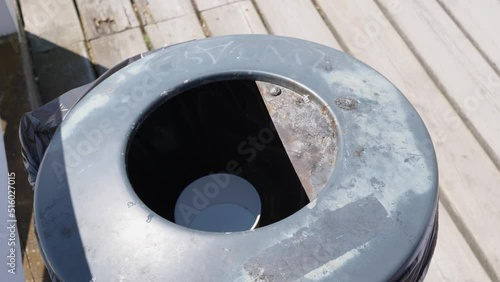 Girl throwing away single use fork and bowl