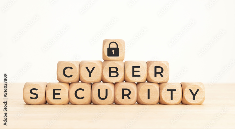 Cybersecurity data protection concept. Text and lock pad icon on wooden blocks Cybersecurity data protection concept. Text and lock pad icon on wooden blocks