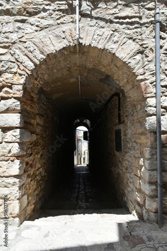 A narrow street between the old houses of Pietragalla  a village in the Basilicata region  Italy.