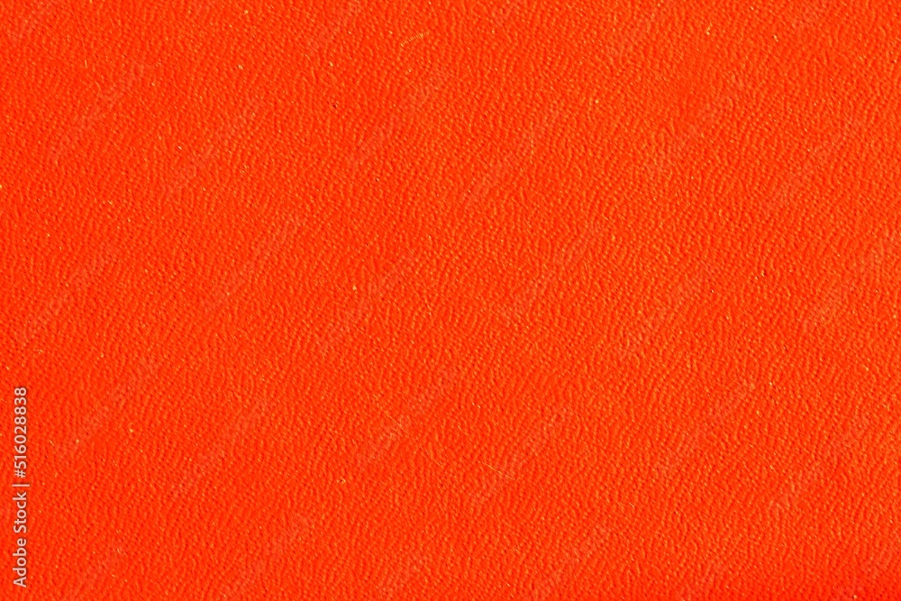 Abstract design halloween holiday background of glossy artificial genuine textured orange creased leather. Flat surface. Skin natural wrinkled scratched wallpaper pattern. Close-up, mock up, top view Abstract design halloween holiday background of glossy artificial genuine textured orange creased leather. Flat surface. Skin natural wrinkled scratched wallpaper pattern. Close-up, mock up, top view