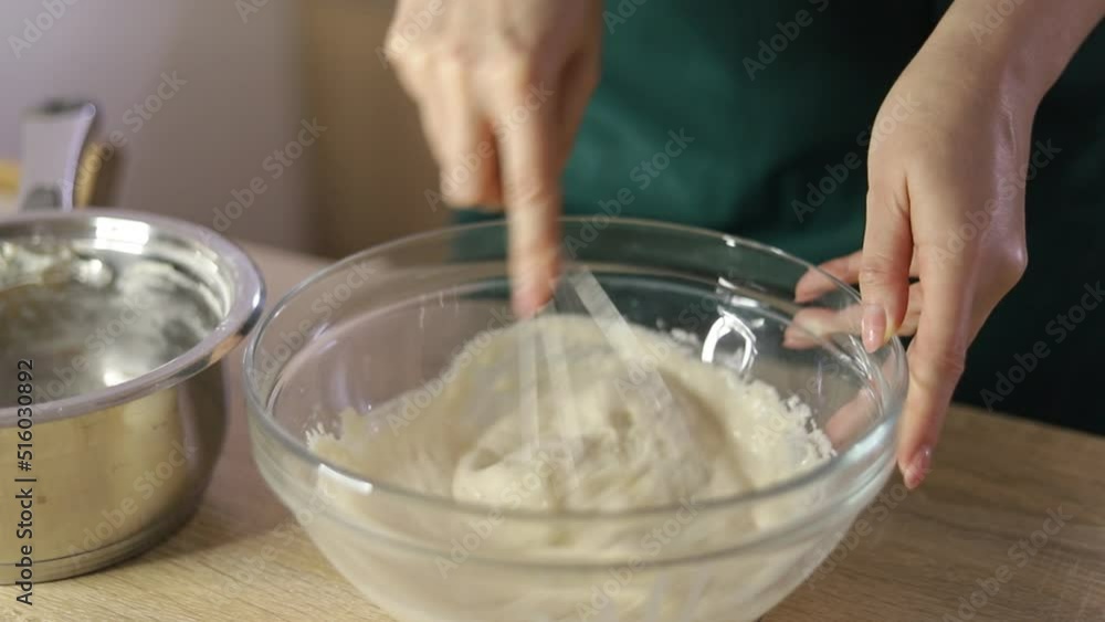 The confectioner kneads the dough The confectioner kneads the dough