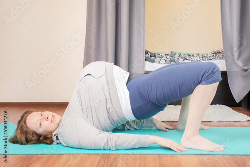 pregnant woman doing sports exercises at home,doing fitness,keep body shape and health during pregnancy