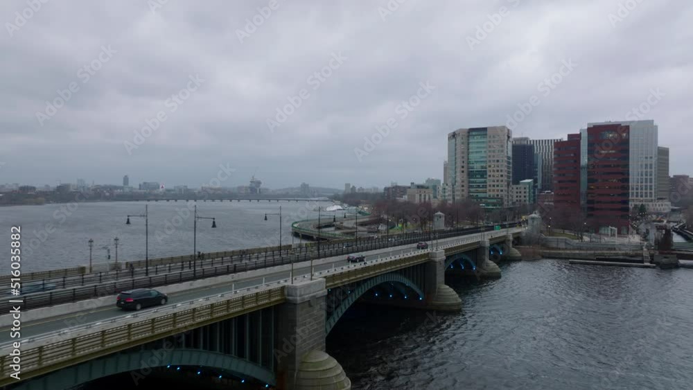 Forwards fly above Longfellow Bridge over Charles river. Vehicles driving on road along railway tracks. Boston, USA Forwards fly above Longfellow Bridge over Charles river. Vehicles driving on road along railway tracks. Boston, USA