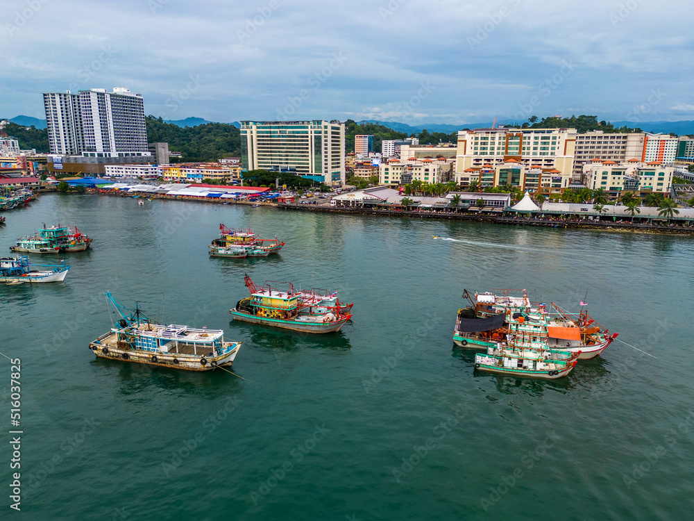An aerial view of fishing vessels park for the day at Kota Kinabalu Sabah