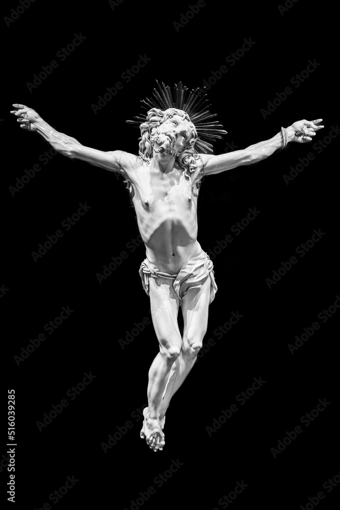 Jesus Christ - Old crucifix, Catholic Church, on black background with copy space.