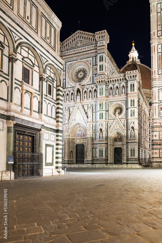 Italy, Florence by night. The illuminated architecture of the cathedral exterior.