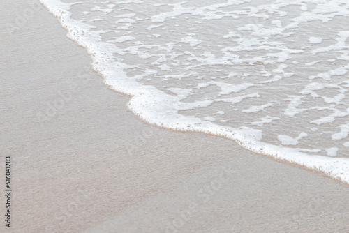Soft waves on a beautiful beach in the evening.