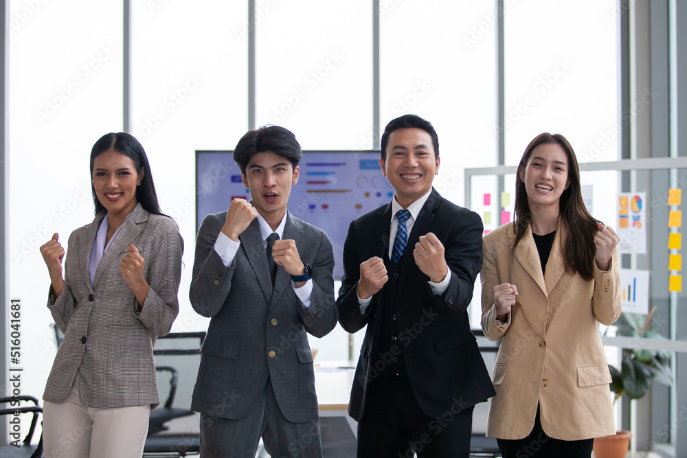 Asian business team celebrate corporate victory together in office, laughing and rejoicing, smiling excited employees colleagues screaming with joy in office. Asian business team celebrate corporate victory together in office, laughing and rejoicing, smiling excited employees colleagues screaming with joy in office.