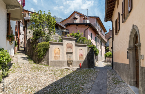 Narrow cobblestone streets with stone houses in the small ancient village Naggio in the province of Como, Lombardy, Italy