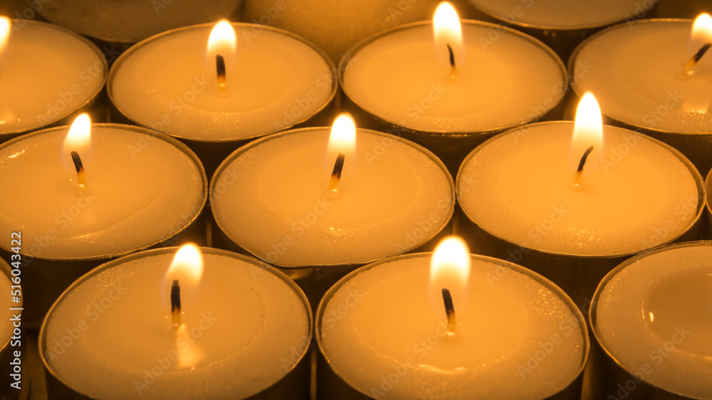 Burning candles in full screen, Several lit candles Burning candles in full screen, Several lit candles