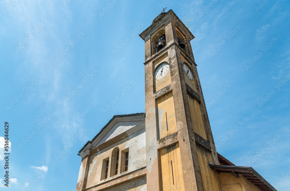 The bell tower of the old church of Saint Antnio Abate in the small ancient village Naggio, province of Como, Lombardy, Italy