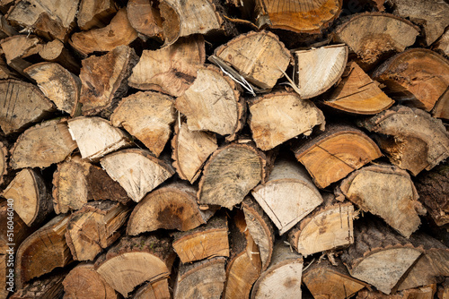 Stacked Pile of dry Firewood Logs Background