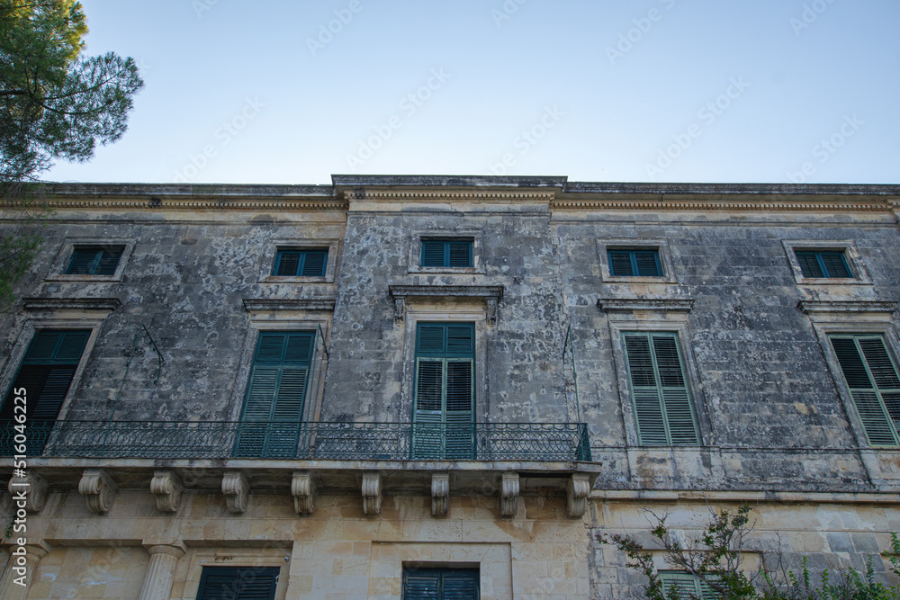 Old traditional venetian blinds on old wall at Kerkyra town in Corfu Greece