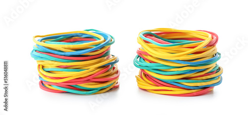 Stacks of colorful rubber bands isolated on white background