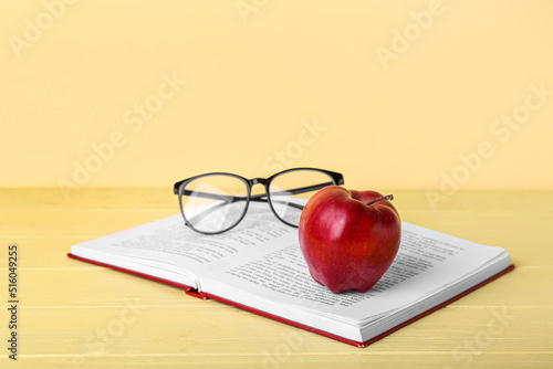 School book with apple and ...