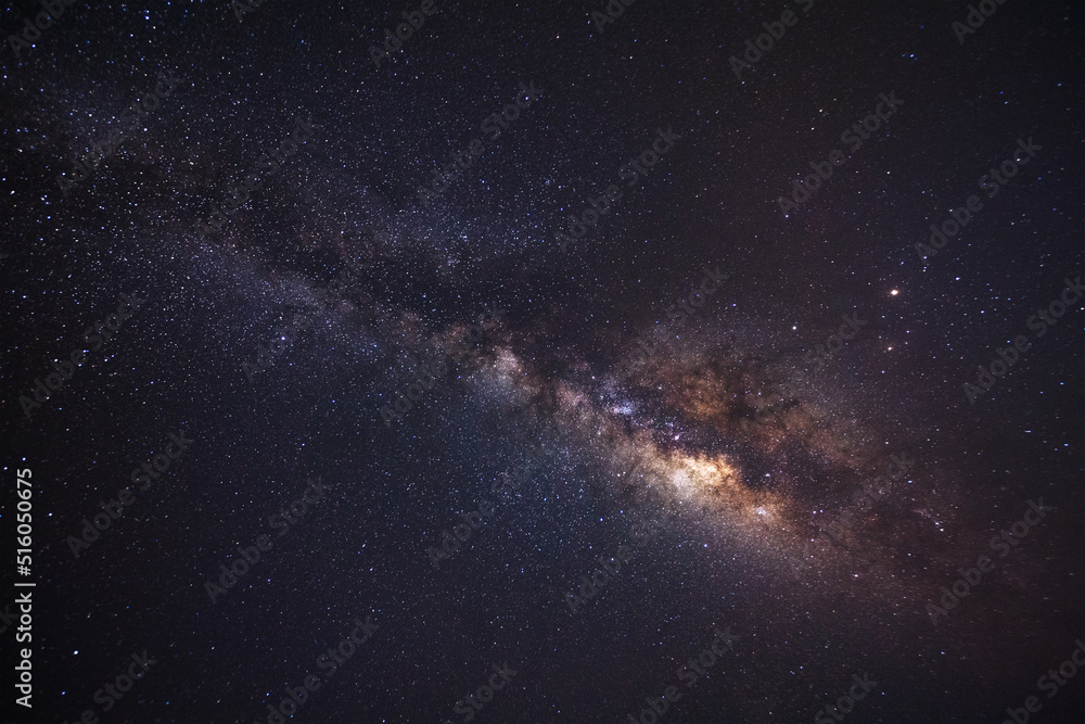 Fototapeta premium milky way galaxy and space dust in the universe, Long exposure photograph, with grain.
