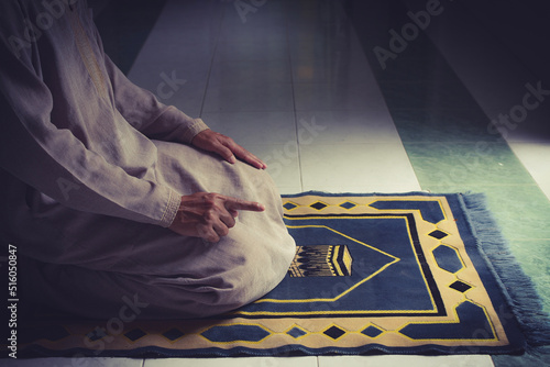 religious muslim man pray on prayer cloth in mosque,gester of prayer,concept for rite in islam,workship,religion