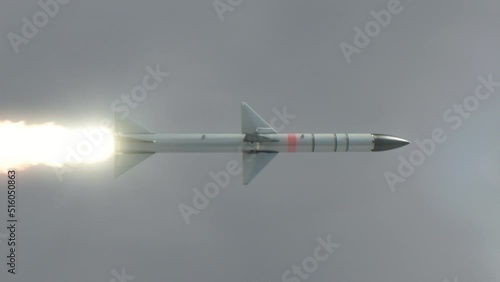 Launched Missile flying in the clouds. photo