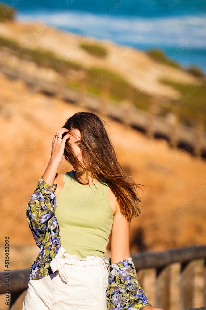 woman on the beach in Portugal Algarve woman on the beach in Portugal Algarve