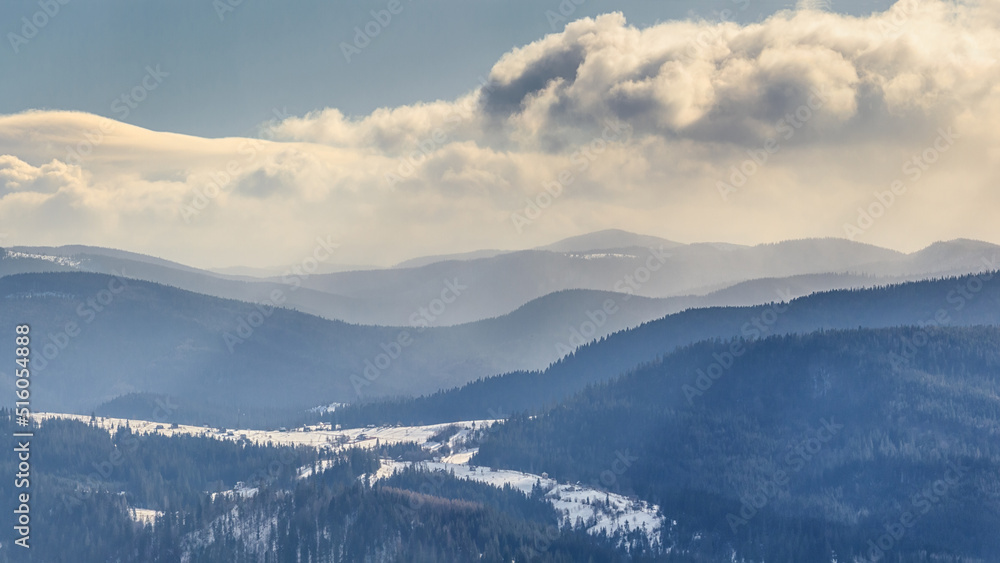 Winter landscape - top view of the snowy mountain valley in the Carpathians, in Ukraine