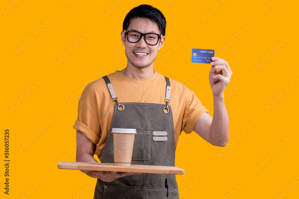 smart friendly asian male glasses barista small coffee shop owner in apron hand gesture welcome customer come and enjoy his coffee drink,happy asia man show coffee and credit card online studio shot