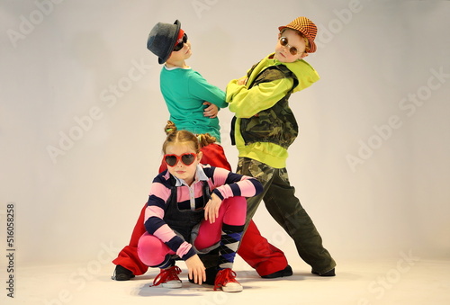 Happy kids  hip hop group of children  kids in sunglasses boys and girl  street style  hip hop style    colourful clothes   dancers  