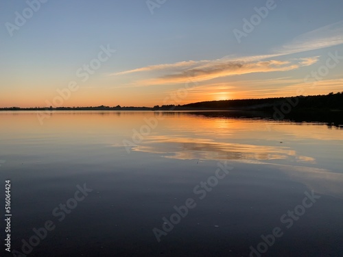Rural sunset over the river © lijphoto