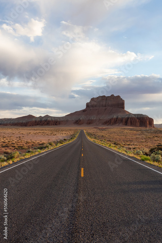 Scenic Road in the Desert with Red Rocky Mountains. Spring Season. Near Goblin Valley State Park. Utah, United States. Adventure Travel.