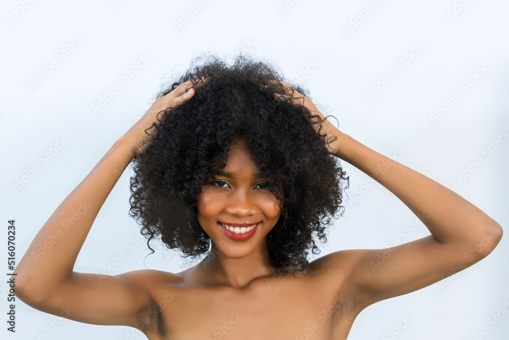 Portrait of African American woman with bushy curly hairstyle Portrait of African American woman with bushy curly hairstyle