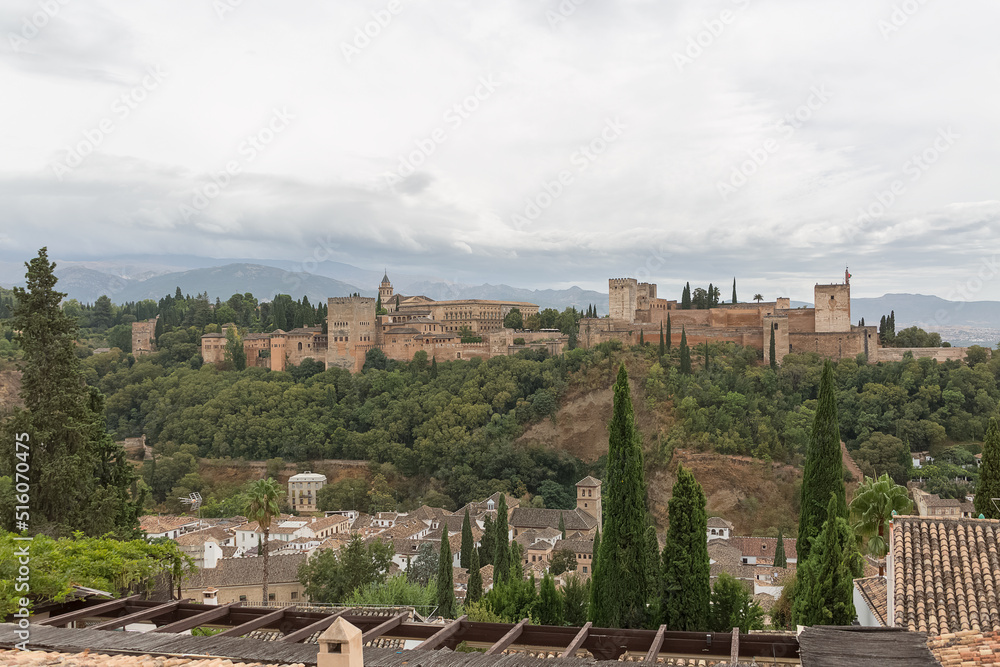 View at the exterior facade building at the Alhambra citadel and gardens, view Viewpoint San Nicolás, a palace and fortress complex located in Granada, Spain
