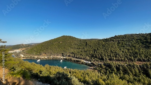 Cennet Bay is one of Bodrum's unique bays. This place, which is frequently preferred by people who want to take a vacation, has a fascinating beauty with its unique landscape and magnificent sea. © sultan