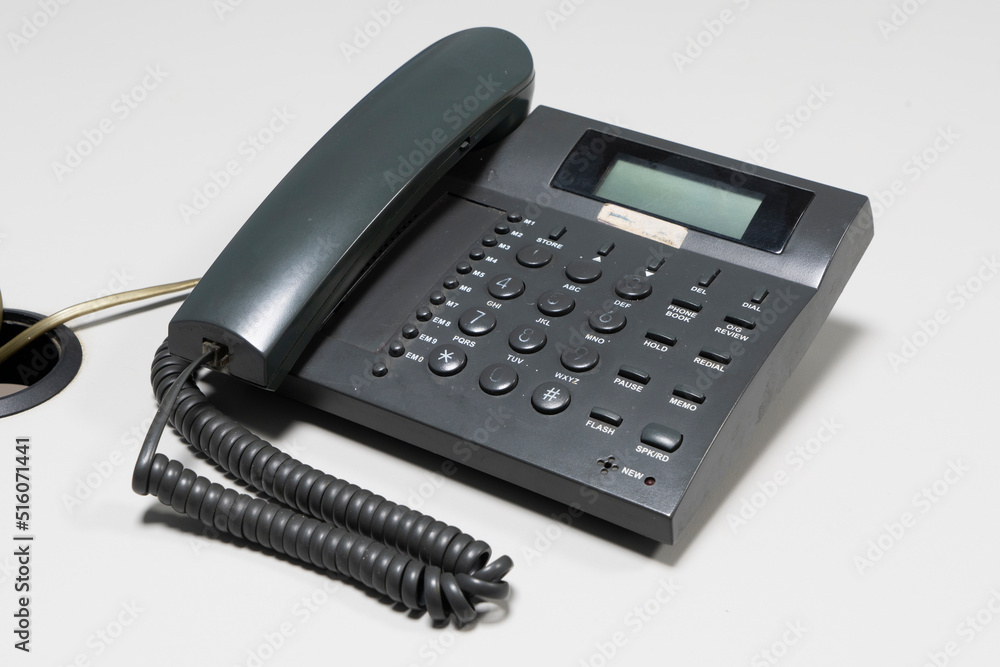 Image of phone taken with selective focus on gray background. Image of phone taken with selective focus on gray background.